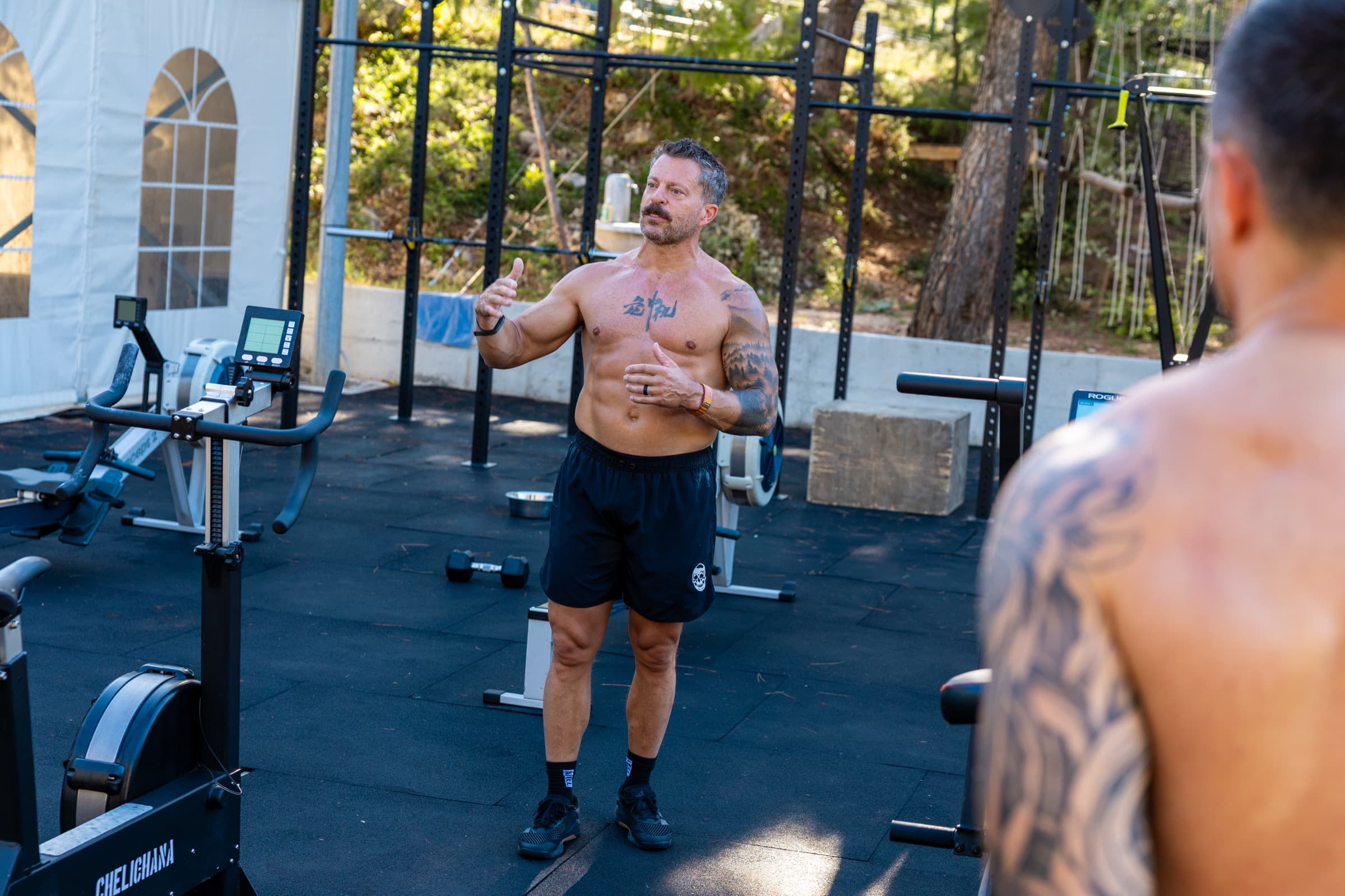Jason Grubb coaching an athlete at an outdoor training session